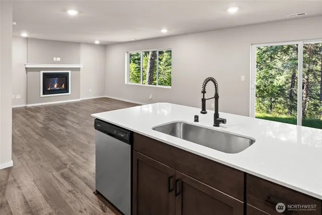 a kitchen with a sink and a large window