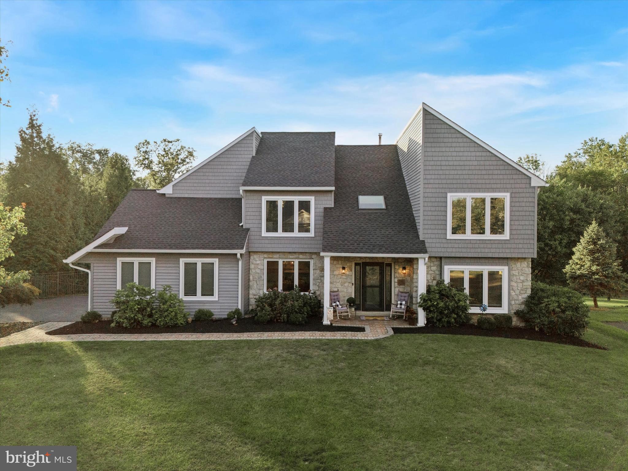 222 Windsor Way Doylestown, PA 18901 - Photo 1 of 42 a front view of a house with a yard