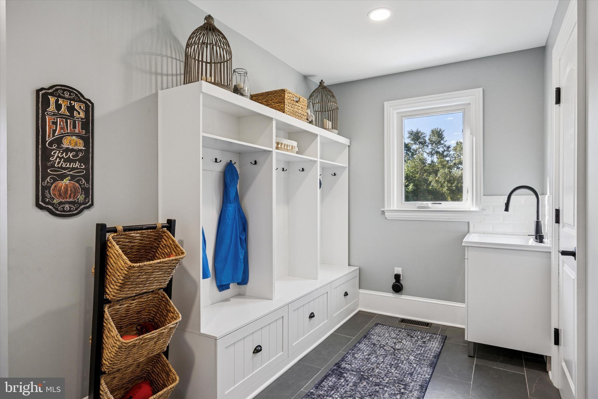 222 Windsor Way Doylestown, PA 18901 - Photo 13 of 42 a room with a baby crib and a wooden floor