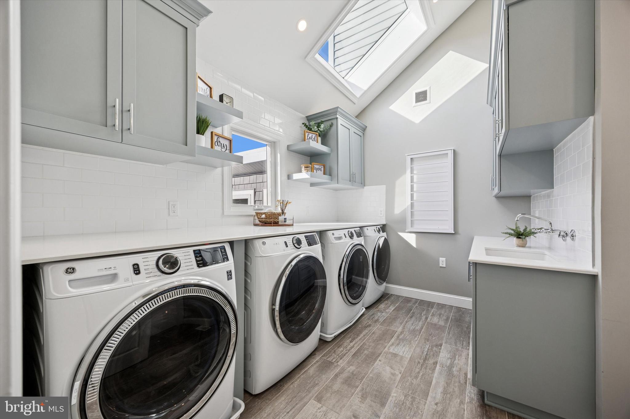 222 Windsor Way Doylestown, PA 18901 - Photo 19 of 42 a view of washer and dryer with kitchen in the background
