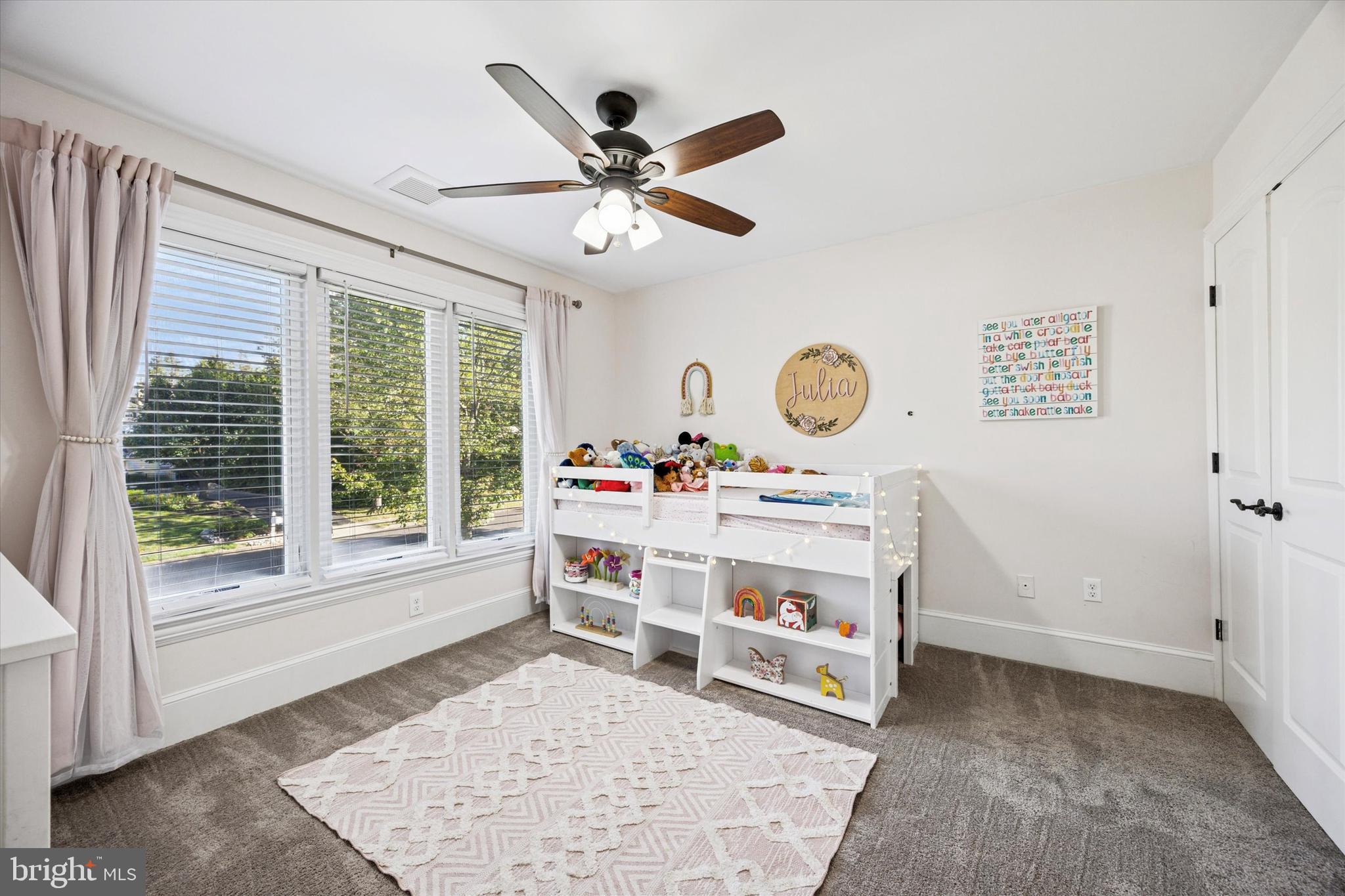 222 Windsor Way Doylestown, PA 18901 - Photo 23 of 42 a living room with a baby crib furniture and a window