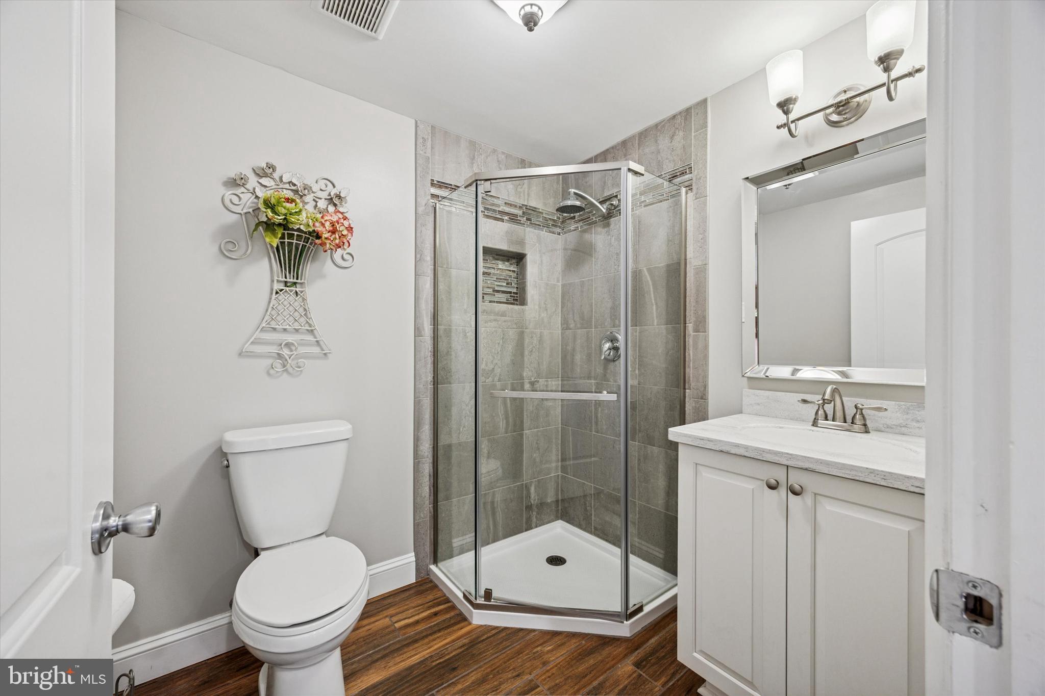 222 Windsor Way Doylestown, PA 18901 - Photo 35 of 42 a bathroom with a toilet sink and shower
