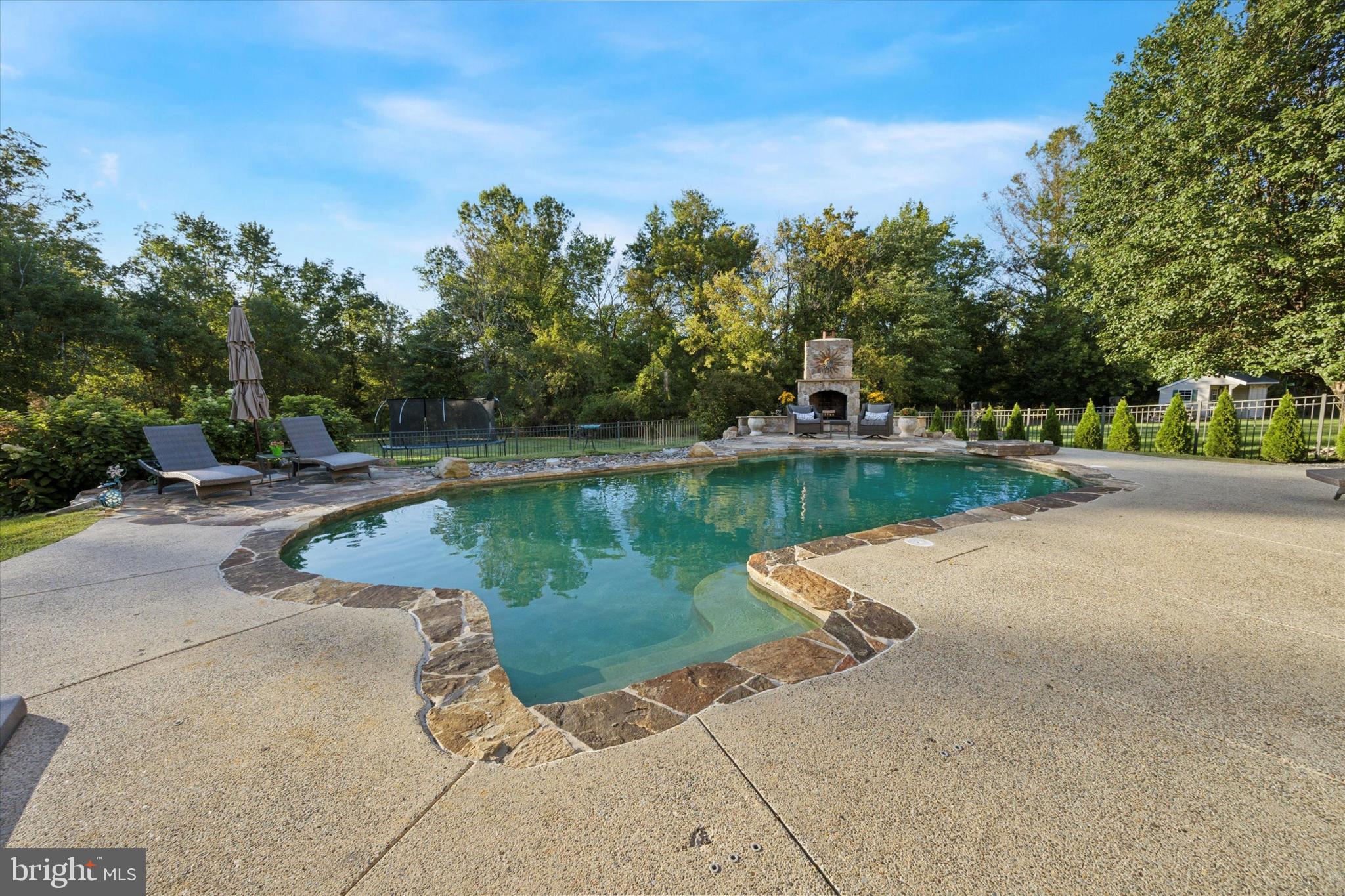 222 Windsor Way Doylestown, PA 18901 - Photo 36 of 42 a view of a lake with a yard and large trees