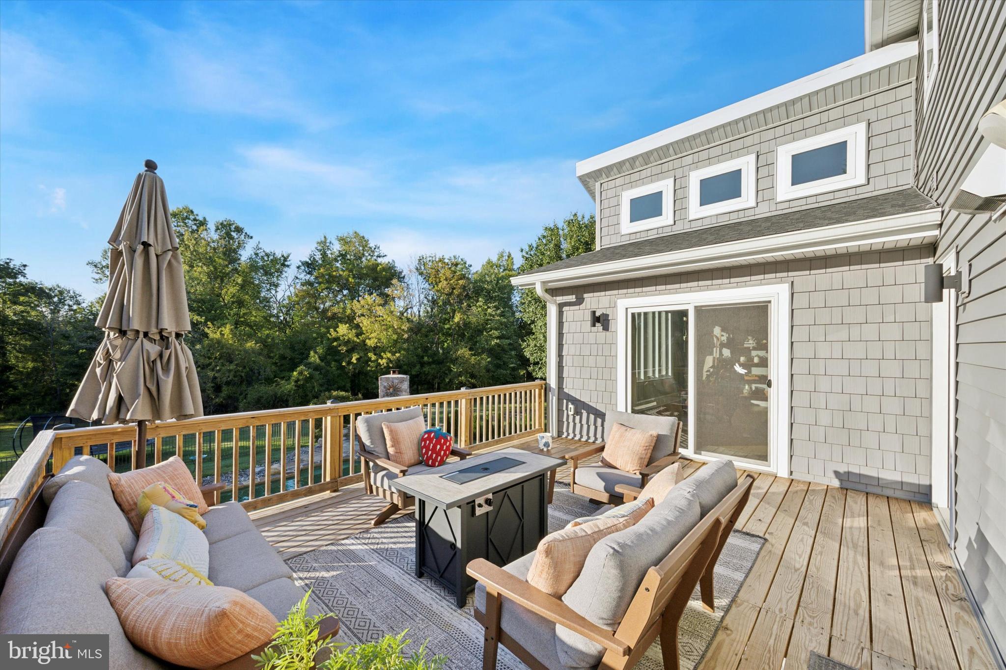 222 Windsor Way Doylestown, PA 18901 - Photo 38 of 42 a view of deck with a table and chairs and wooden floor