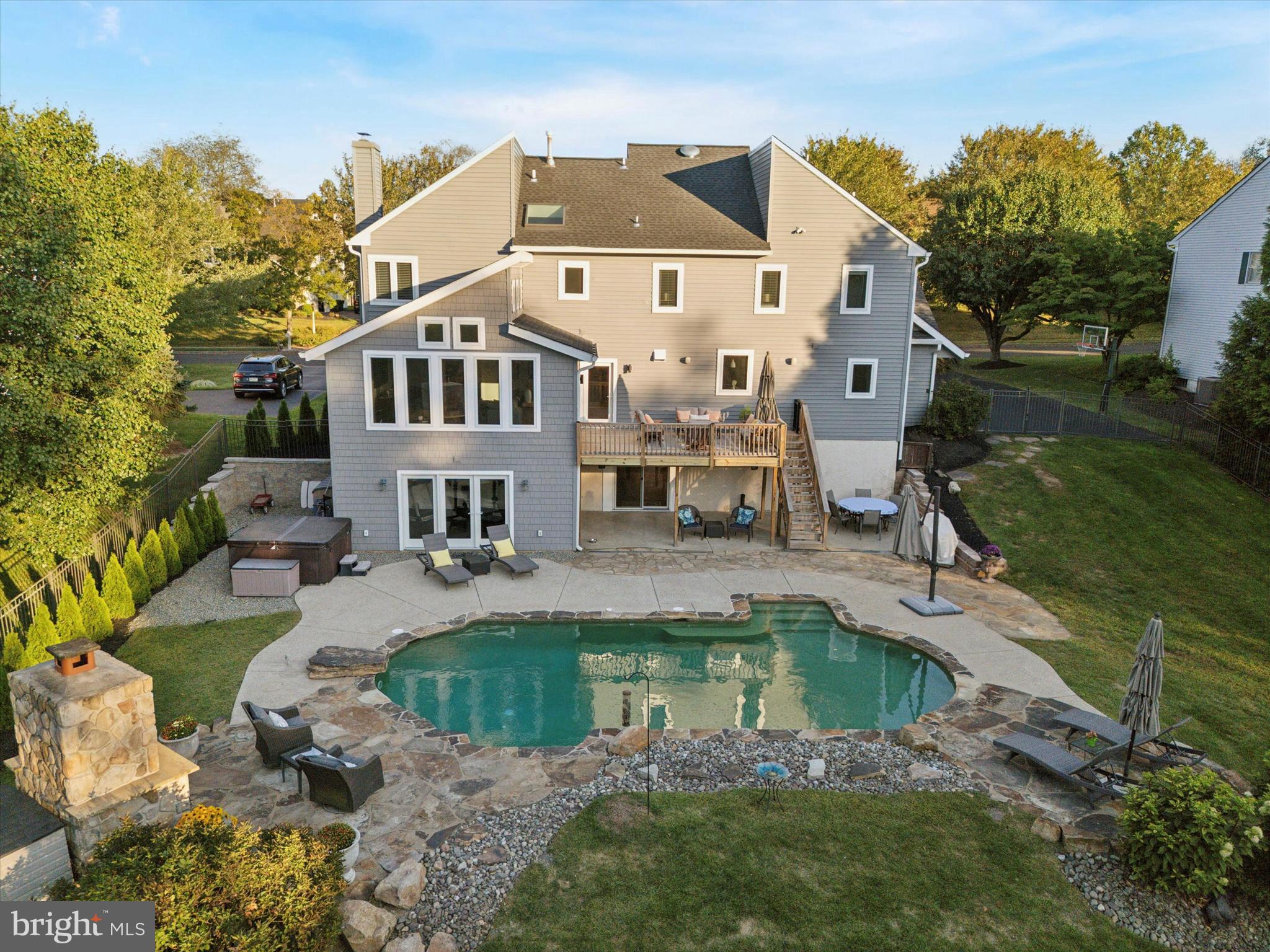 222 Windsor Way Doylestown, PA 18901 - Photo 39 of 42 a white building with a big yard plants and large trees