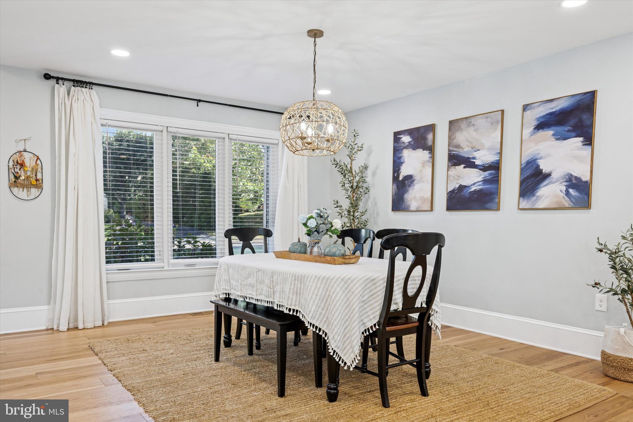 222 Windsor Way Doylestown, PA 18901 - Photo 5 of 42 a dining room with furniture a chandelier and wooden floor