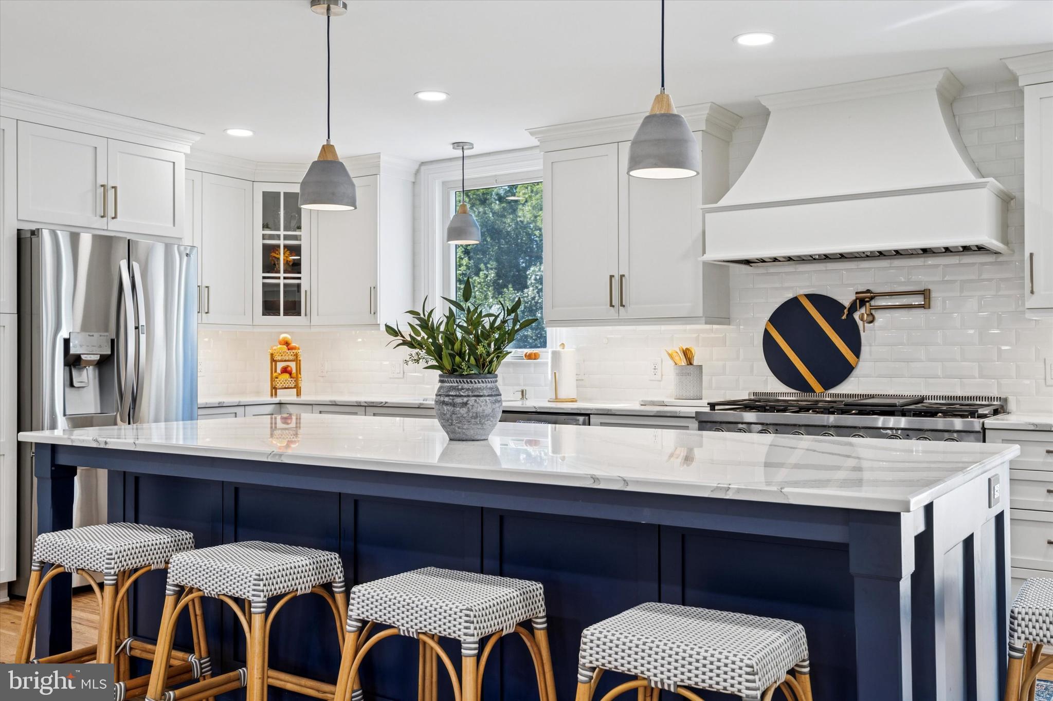 222 Windsor Way Doylestown, PA 18901 - Photo 7 of 42 a kitchen with a table chairs refrigerator and microwave