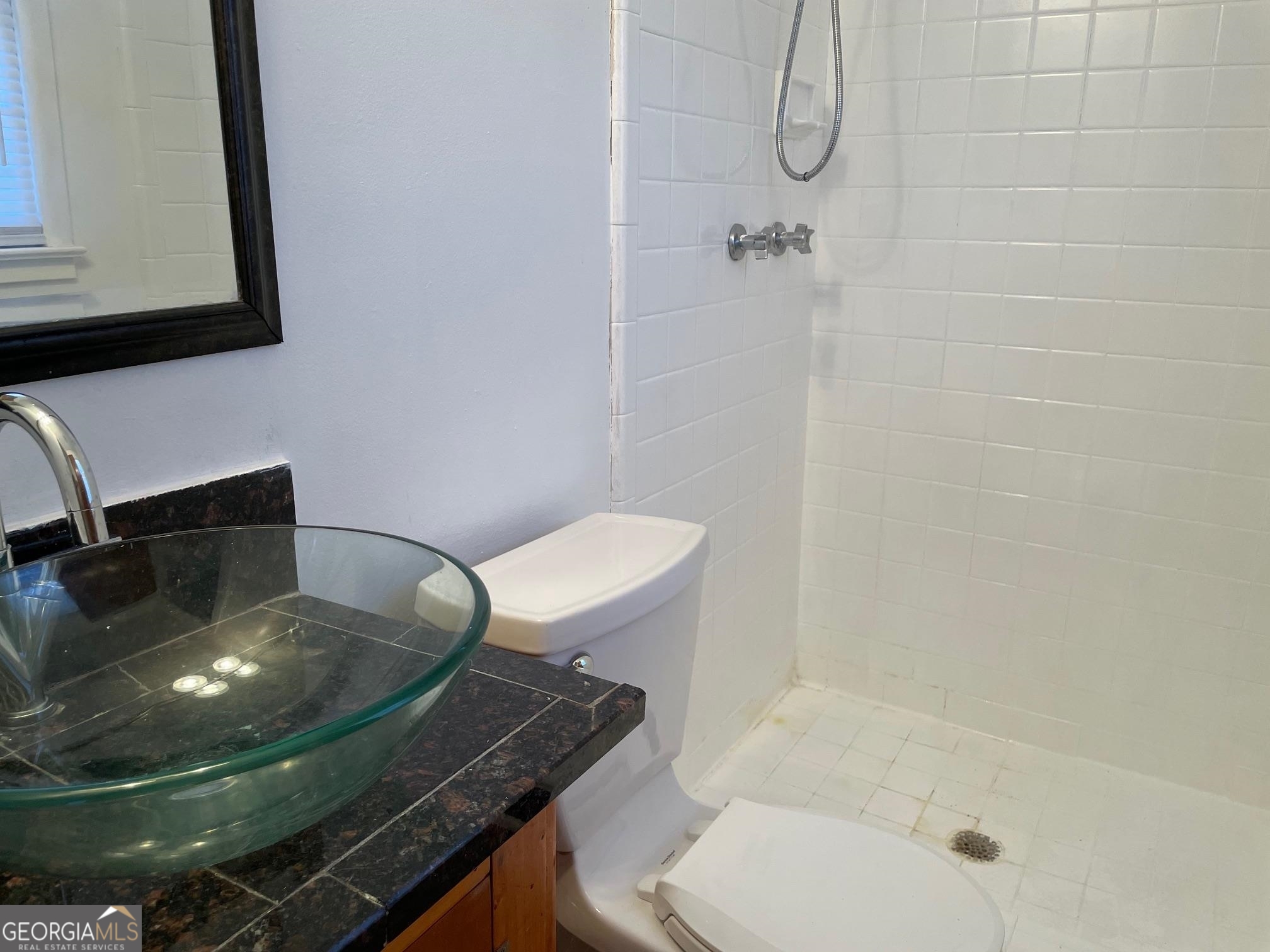 4231 Rue Dartagnan Stone Mountain, GA 30083 - Photo 19 of 23 a bathroom with a sink toilet and shower