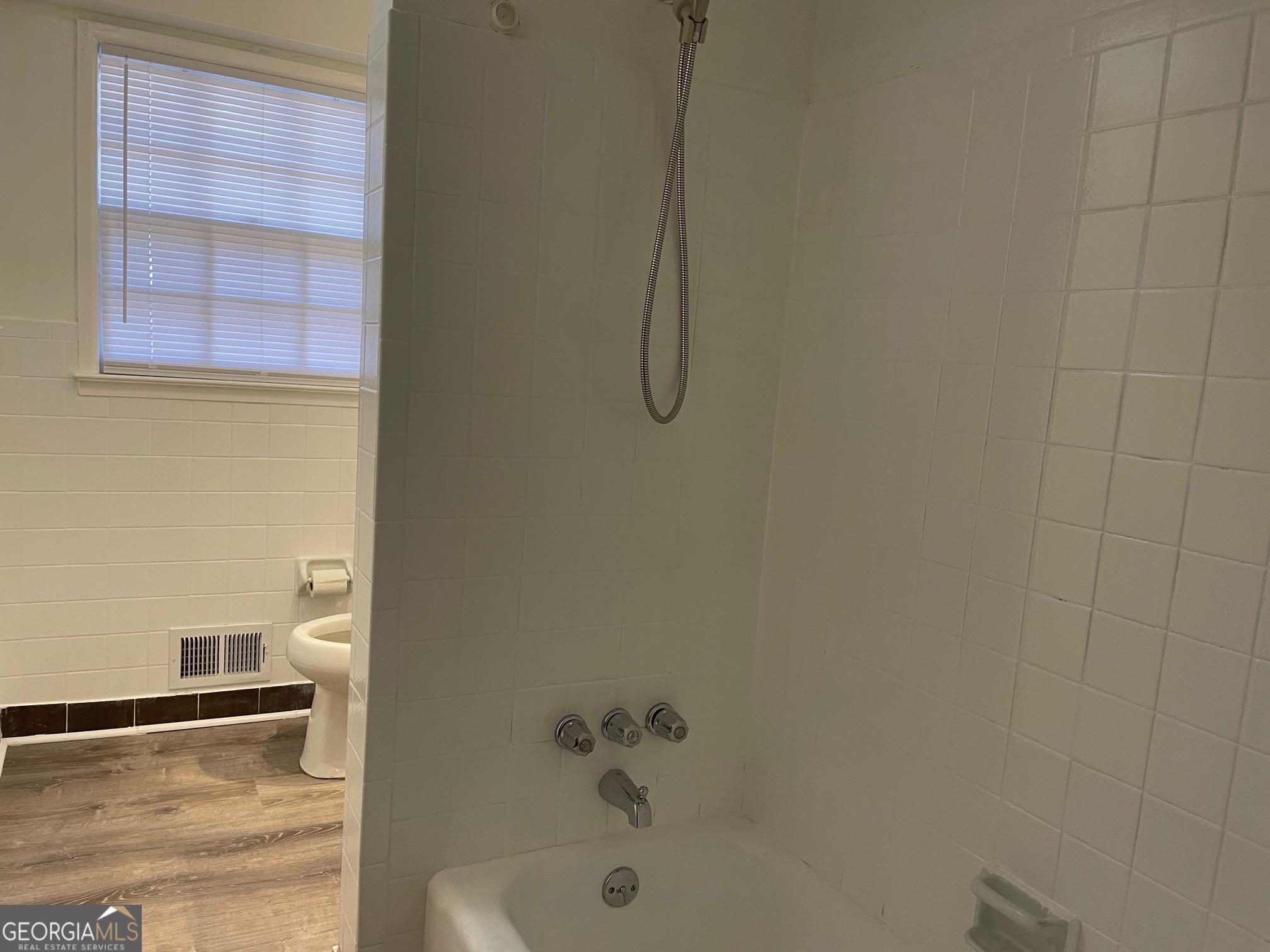 4231 Rue Dartagnan Stone Mountain, GA 30083 - Photo 20 of 23 a bathroom with a bathtub