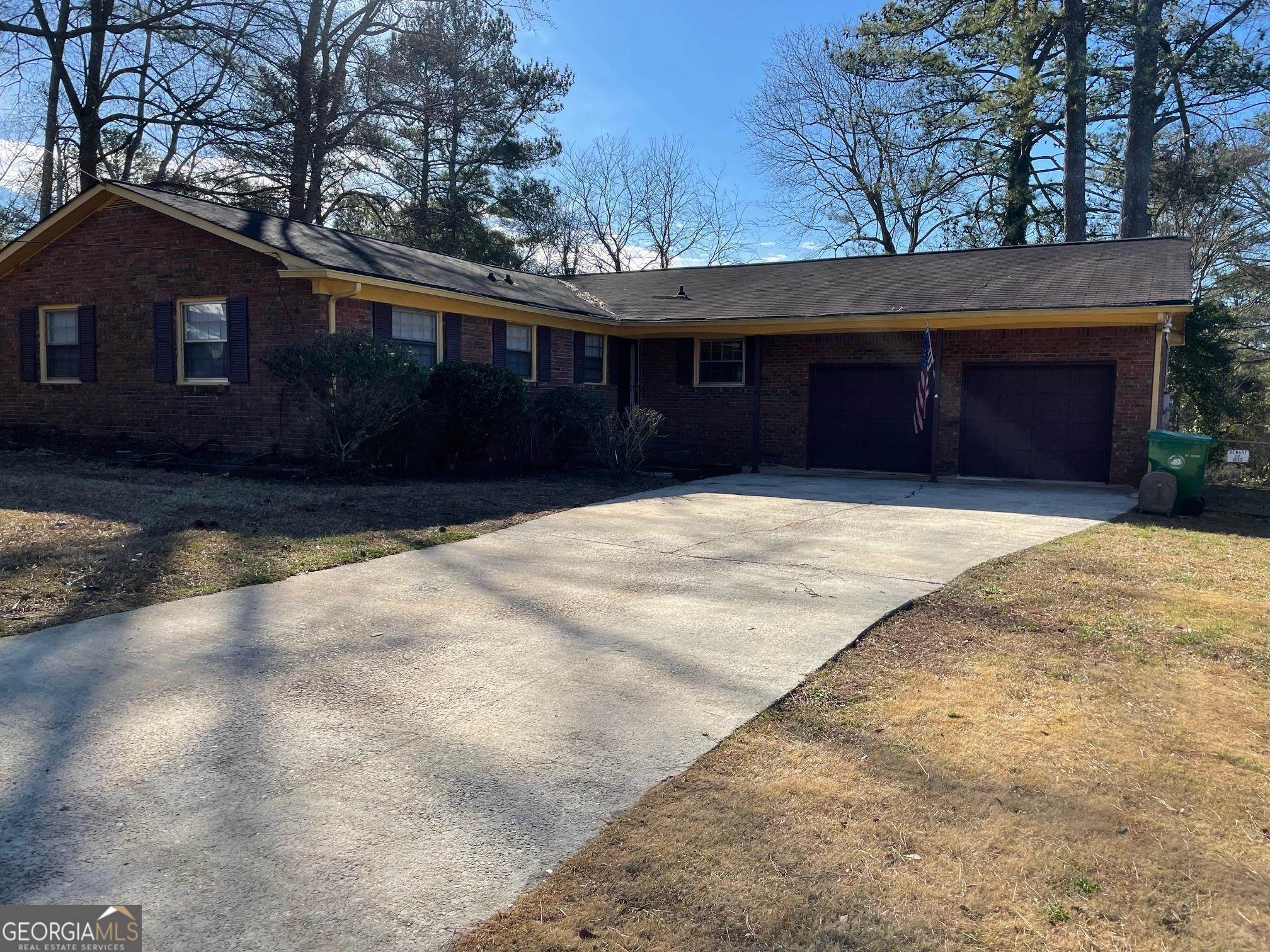 4231 Rue Dartagnan Stone Mountain, GA 30083 - Photo 2 of 23 a front view of a house with a yard