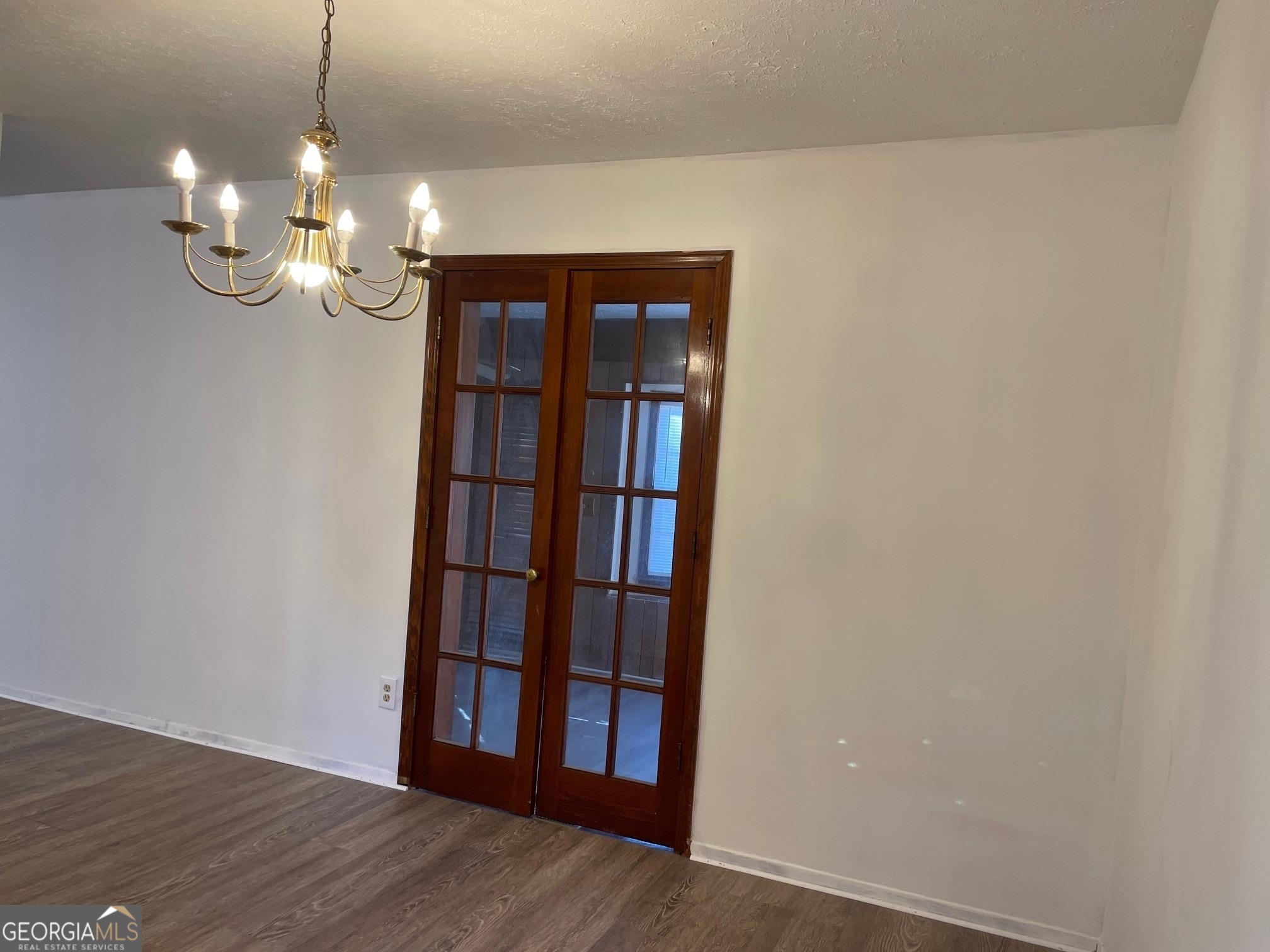4231 Rue Dartagnan Stone Mountain, GA 30083 - Photo 6 of 23 a view of a room with wooden floor and large window