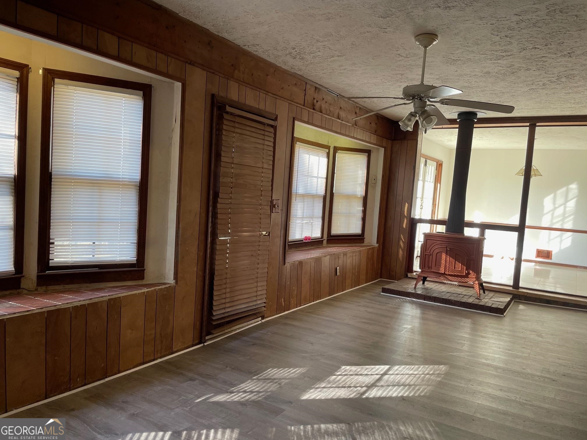 4231 Rue Dartagnan Stone Mountain, GA 30083 - Photo 10 of 23 a view of a room with wooden floor and a window