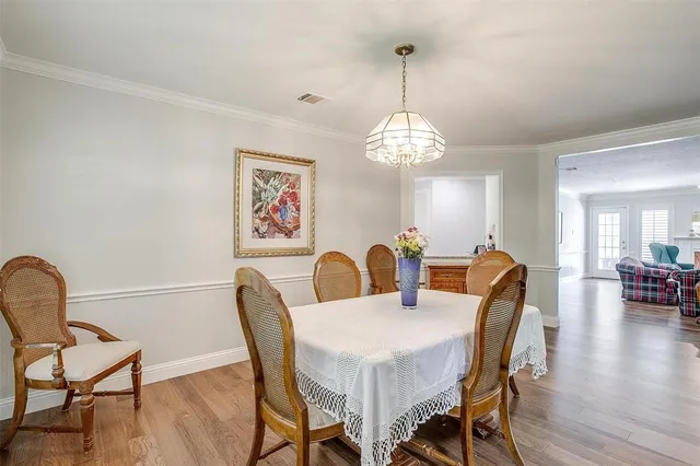 a view of a livingroom with furniture and hardwood floor