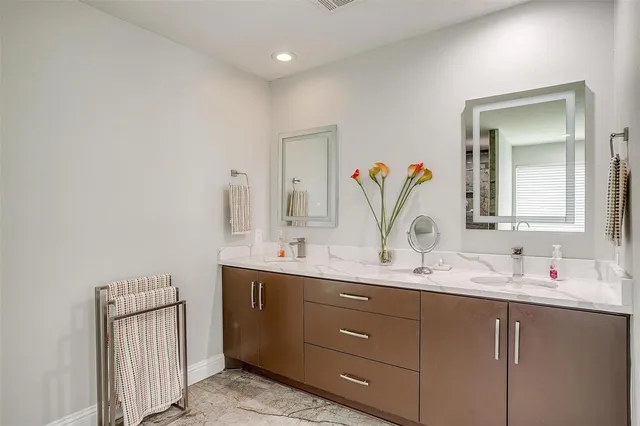 a view of a bathroom with a glass door shower