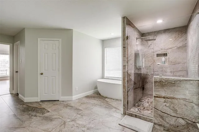 a living room with furniture and a ceiling fan