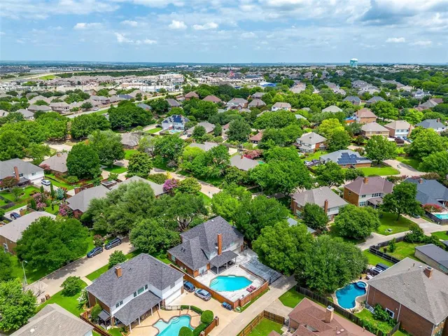 an aerial view of a house with a swimming pool