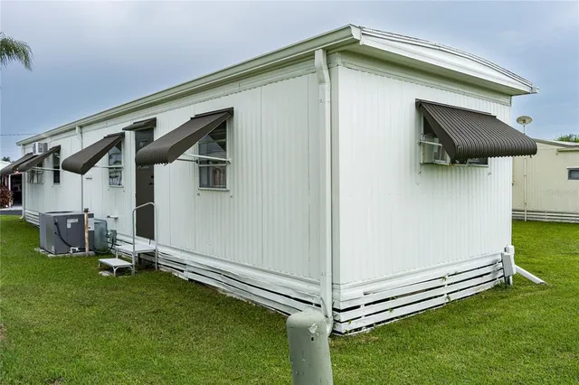 a view of a backyard with a small cabin