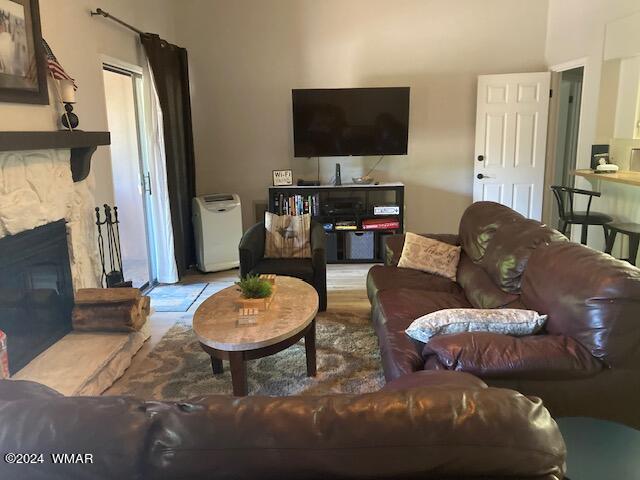 2670 Snow Slope Way Pinetop, AZ 85935 - Photo 2 of 18 a living room with furniture a flat screen tv and a fireplace