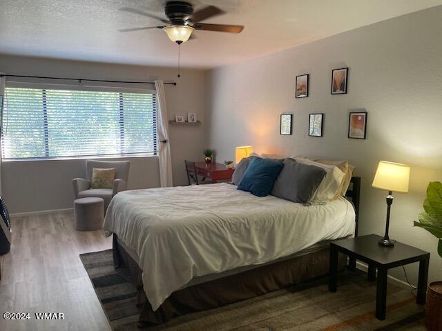 2670 Snow Slope Way Pinetop, AZ 85935 - Photo 6 of 18 a bedroom with a bed and a table