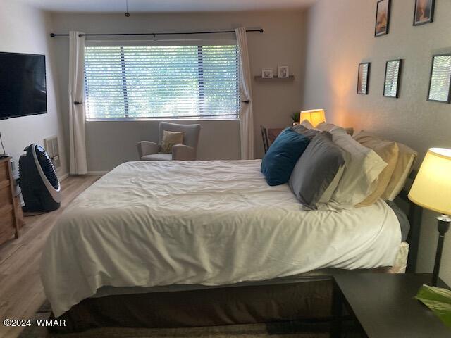 2670 Snow Slope Way Pinetop, AZ 85935 - Photo 7 of 18 a bedroom with a bed and a window
