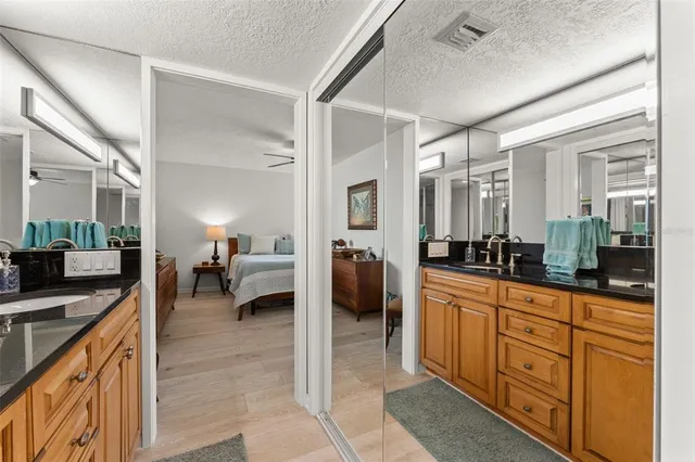 a large white kitchen with cabinets