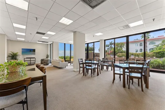 a view of a dining room with furniture window and outside view