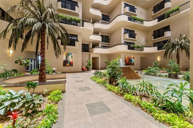 a front view of multiple houses with yard