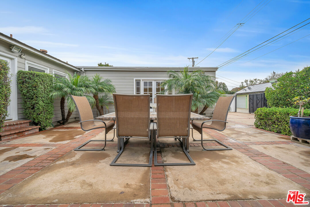 535 Winslow Avenue Long Beach, CA 90814 - Photo 30 of 32 a view of a patio with table and chairs and potted plants