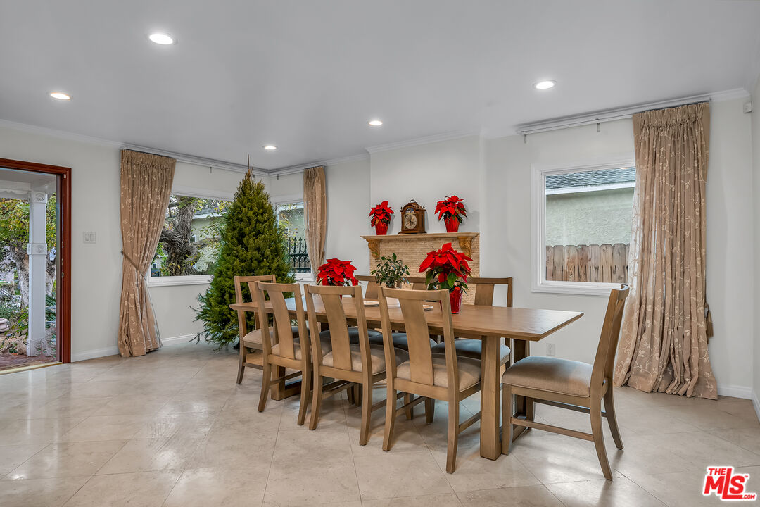 535 Winslow Avenue Long Beach, CA 90814 - Photo 3 of 32 a view of a dining room with furniture and a potted plant