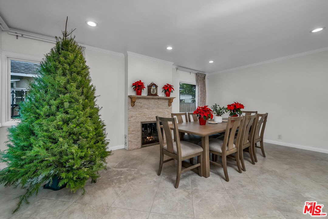 535 Winslow Avenue Long Beach, CA 90814 - Photo 7 of 32 a view of a dining room with furniture and a potted plant