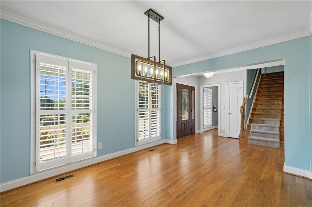 2347 Univeter Road Canton, GA 30115 - Photo 11 of 46 a view of empty room with wooden floor and fan