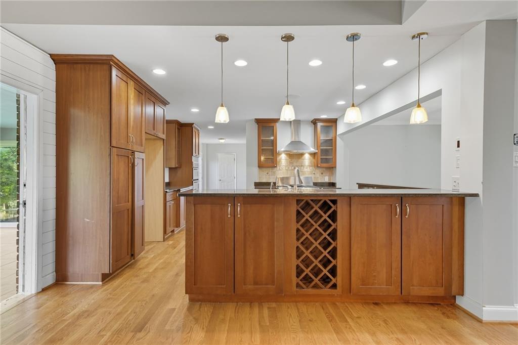 2347 Univeter Road Canton, GA 30115 - Photo 12 of 46 a view of a hallway with wooden floor and a large mirror
