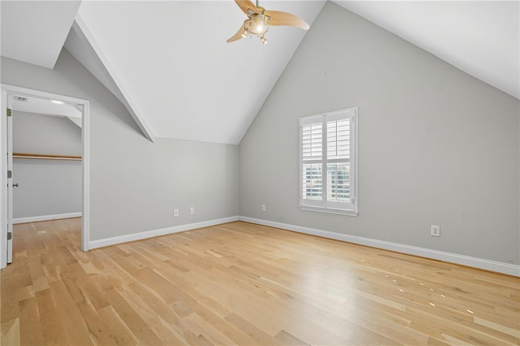 2347 Univeter Road Canton, GA 30115 - Photo 16 of 46 a view of an empty room with wooden floor and a window