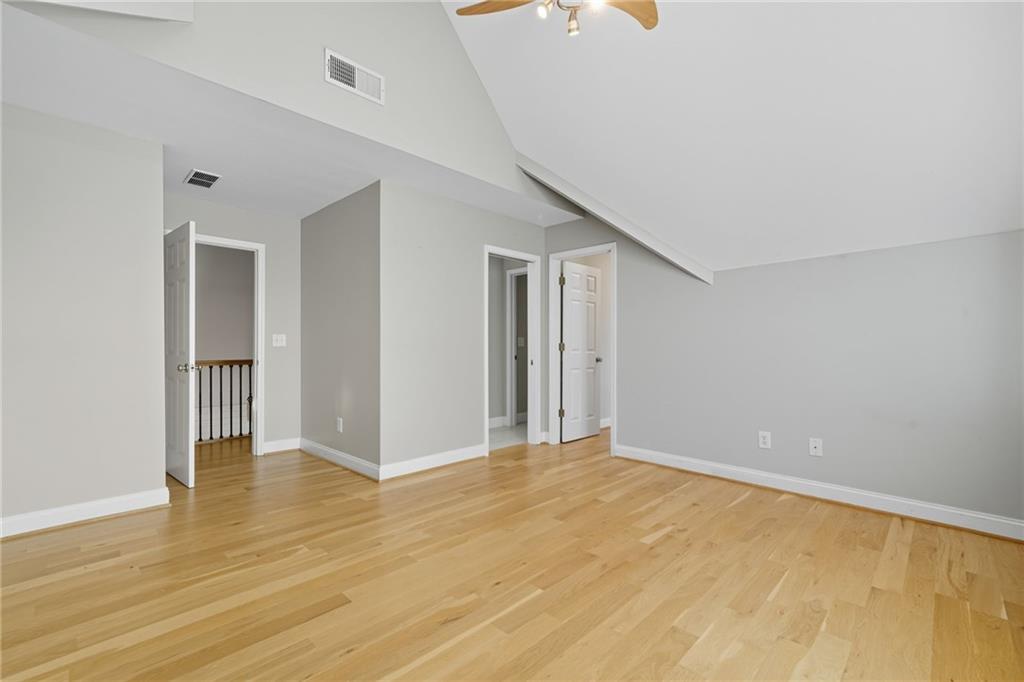 2347 Univeter Road Canton, GA 30115 - Photo 17 of 46 a view of an empty room with wooden floor and a window