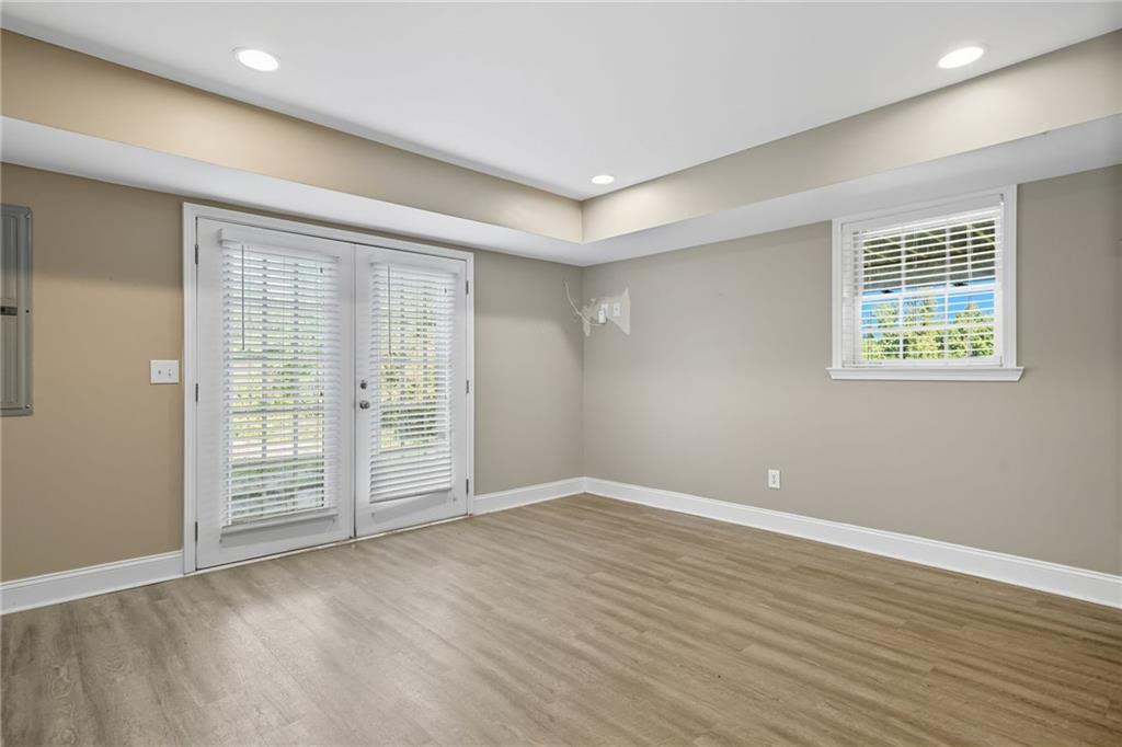 2347 Univeter Road Canton, GA 30115 - Photo 32 of 46 a view of an empty room with wooden floor and a window