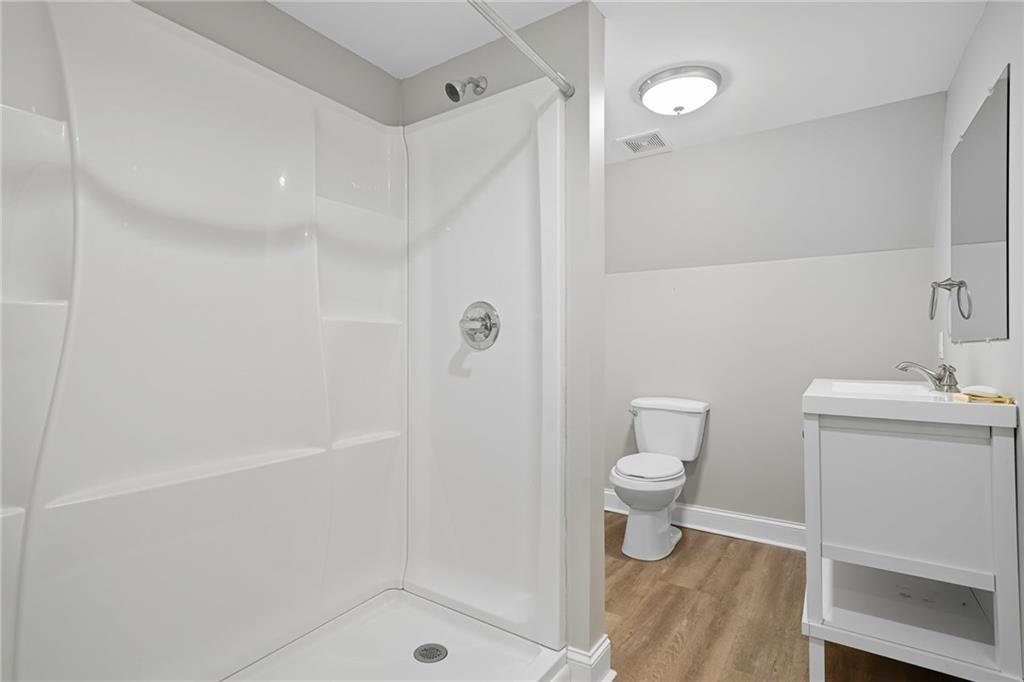 2347 Univeter Road Canton, GA 30115 - Photo 34 of 46 a bathroom with a shower and a toilet