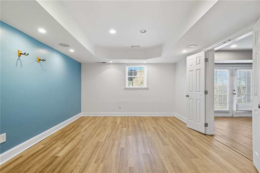 2347 Univeter Road Canton, GA 30115 - Photo 35 of 46 wooden floor in an empty room with a window