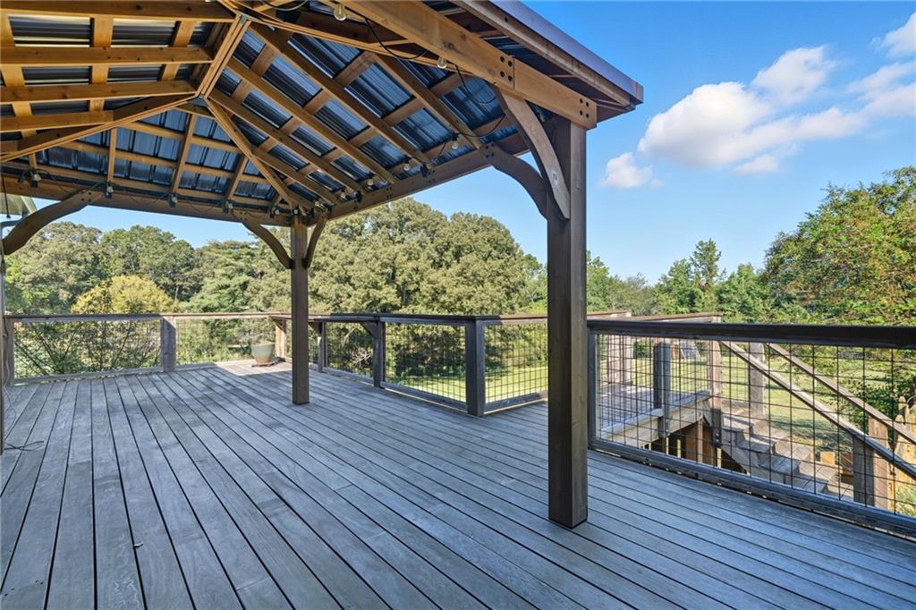2347 Univeter Road Canton, GA 30115 - Photo 37 of 46 a porch with wooden floor in front of house