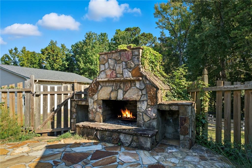 2347 Univeter Road Canton, GA 30115 - Photo 4 of 46 a view of a patio with a fireplace