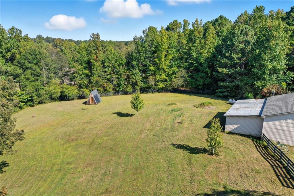 2347 Univeter Road Canton, GA 30115 - Photo 42 of 46 a view of a swimming pool with a yard