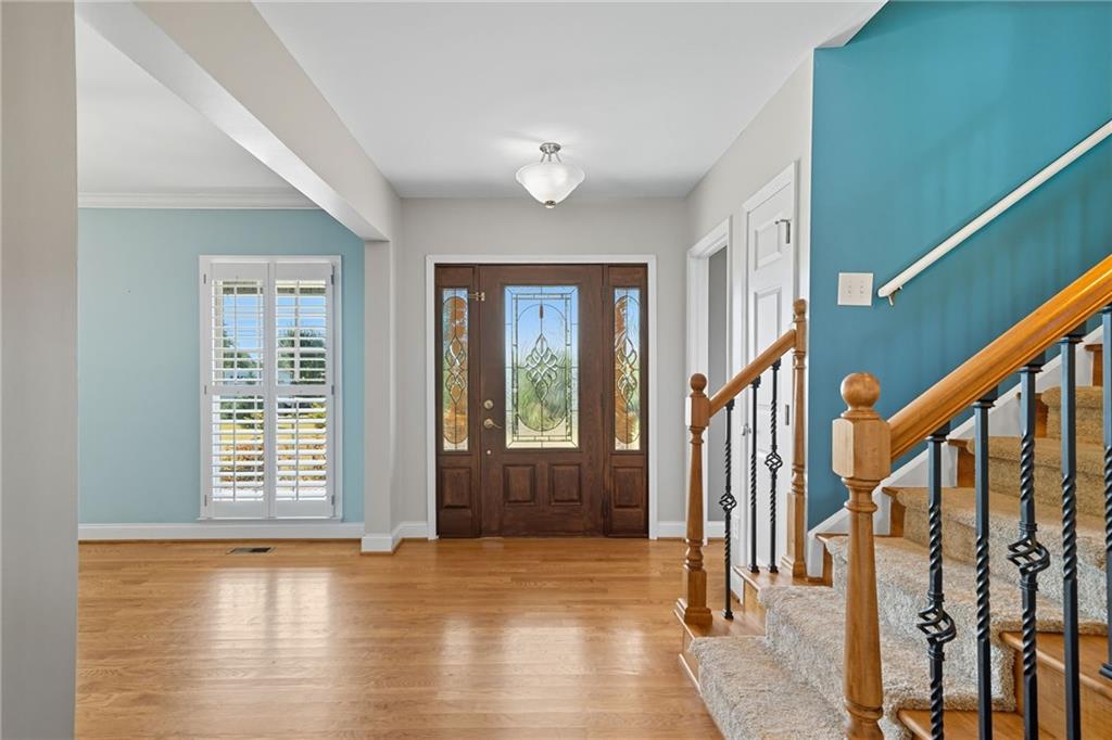 2347 Univeter Road Canton, GA 30115 - Photo 6 of 46 a view of an entryway with wooden floor and windows