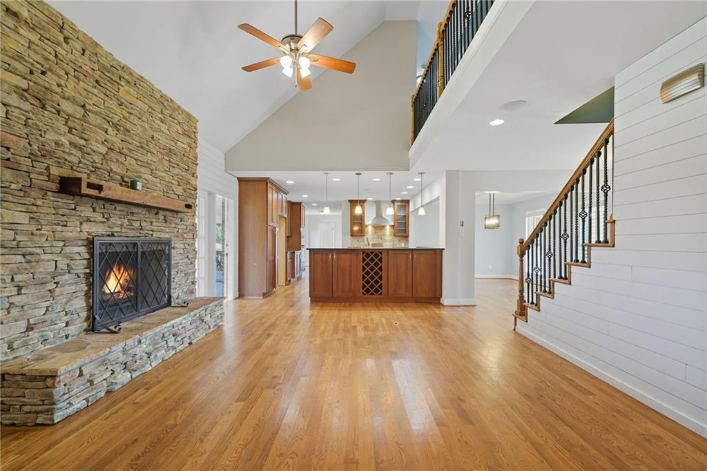 2347 Univeter Road Canton, GA 30115 - Photo 8 of 46 a view of a livingroom with wooden floor and a fireplace
