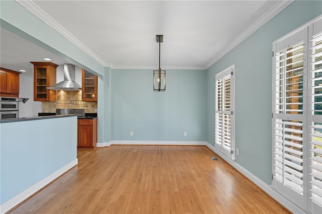 2347 Univeter Road Canton, GA 30115 - Photo 10 of 46 a view of a kitchen with wooden floor and a window