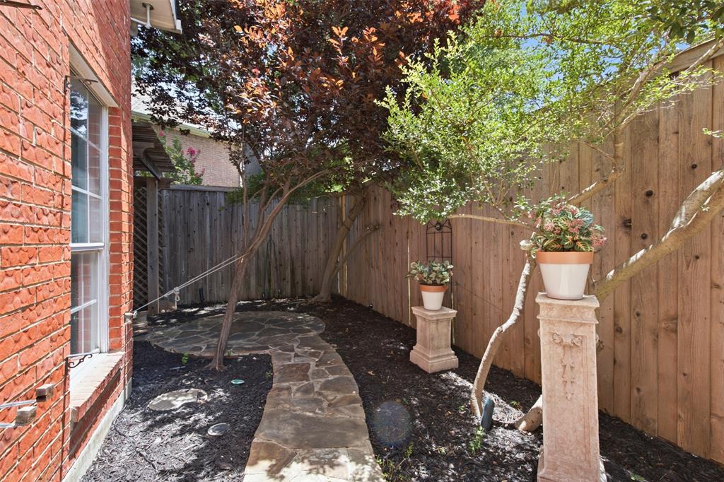 14584 Blueberry Court Addison, TX 75001 - Photo 33 of 40 a view of backyard with wooden fence and large trees