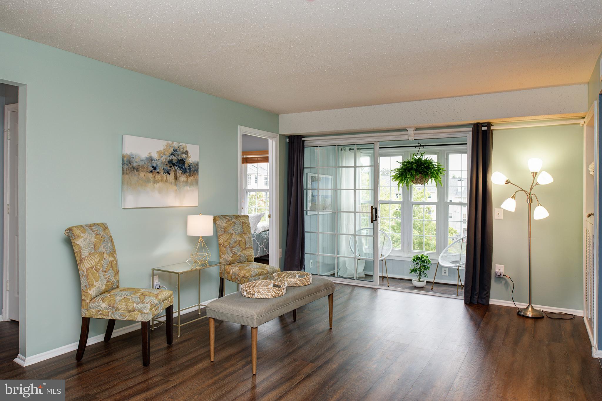 129 Fort Evans Road Southeast, Unit D Leesburg, VA 20175 - Photo 2 of 17 Living Room to back bedroom (bdrm#3) on left