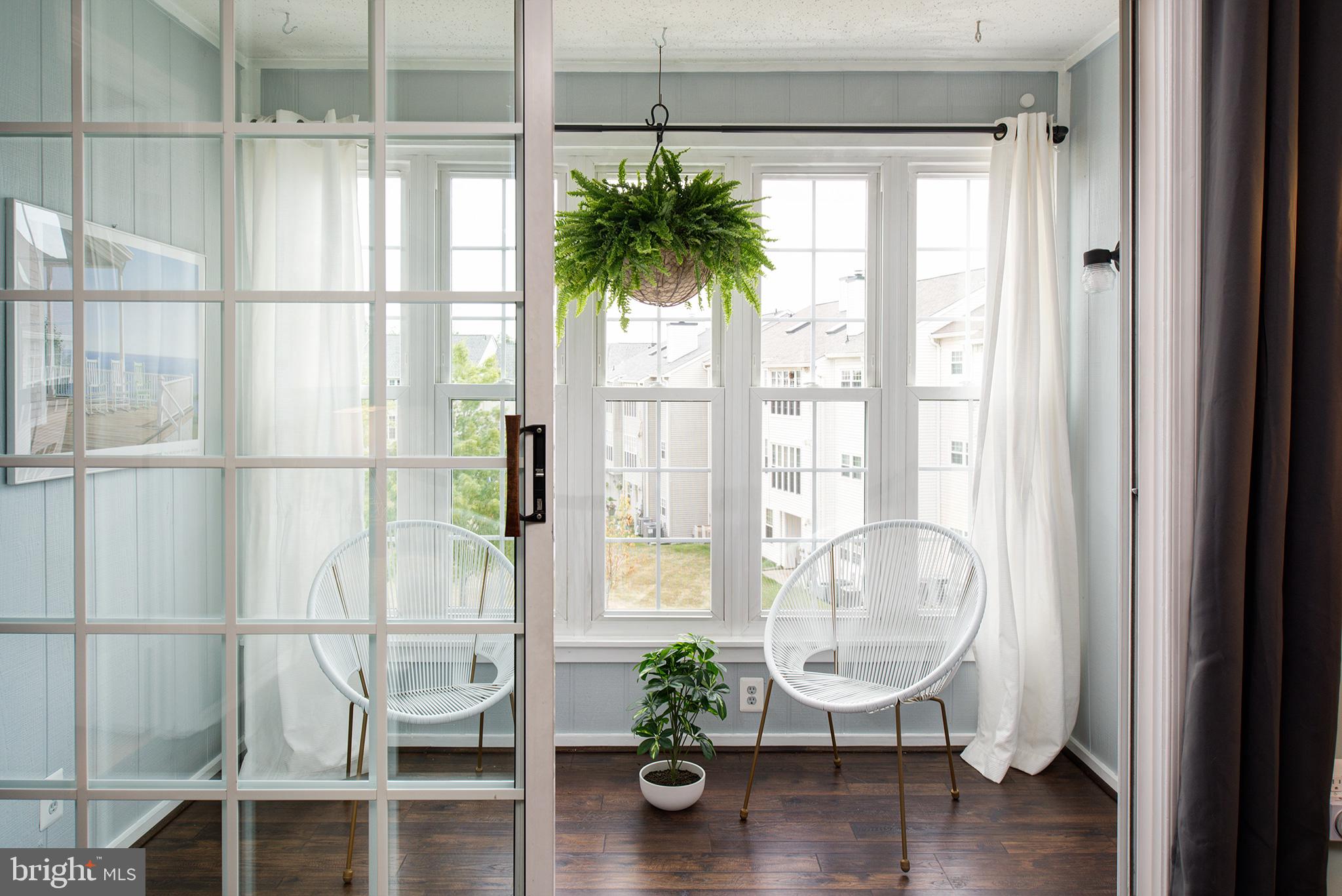 129 Fort Evans Road Southeast, Unit D Leesburg, VA 20175 - Photo 3 of 17 Enclosed porch serves as additional living space