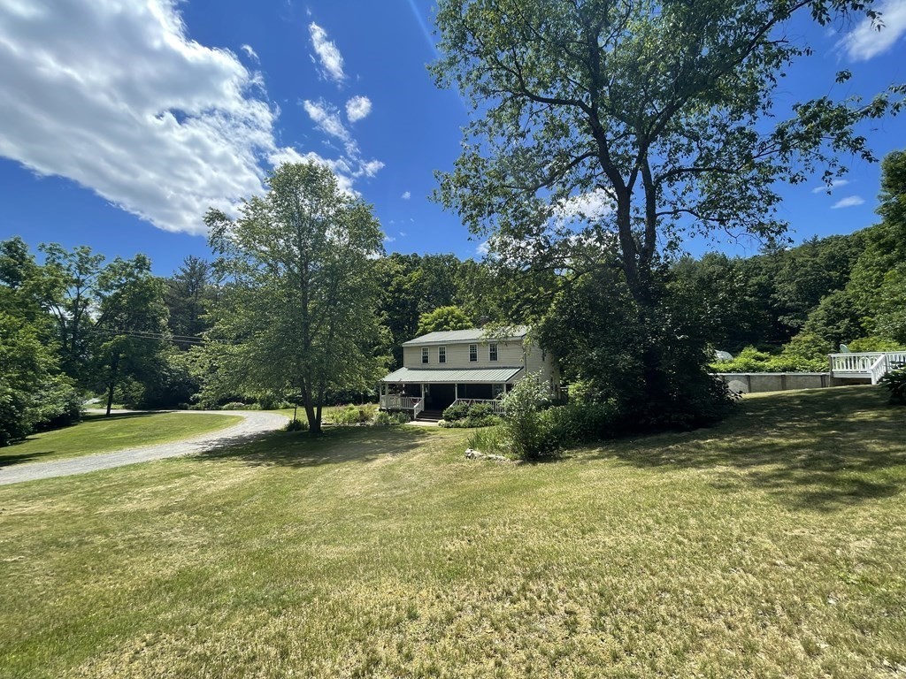 95 West Gill Road Gill, MA 01354 - Photo 1 of 40 a swimming pool with trees in the background