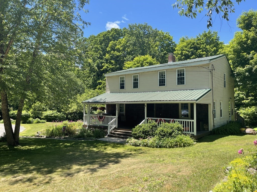 95 West Gill Road Gill, MA 01354 - Photo 2 of 40 a front view of a house with a yard