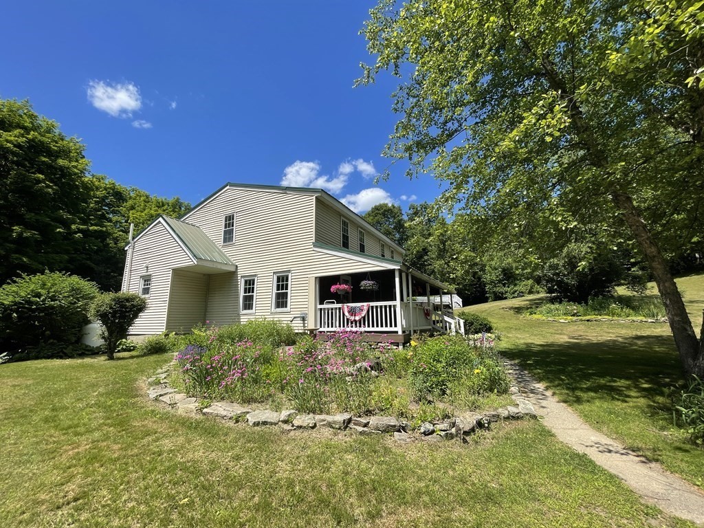 95 West Gill Road Gill, MA 01354 - Photo 3 of 40 a front view of house with yard and green space