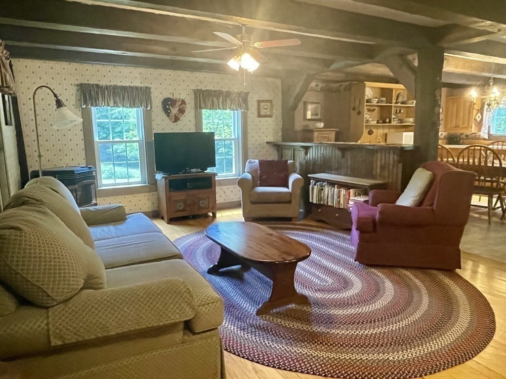 95 West Gill Road Gill, MA 01354 - Photo 5 of 40 a living room with furniture and a fireplace